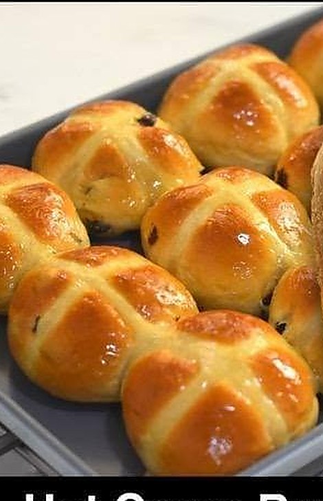 A tray of glazed hot cross buns
